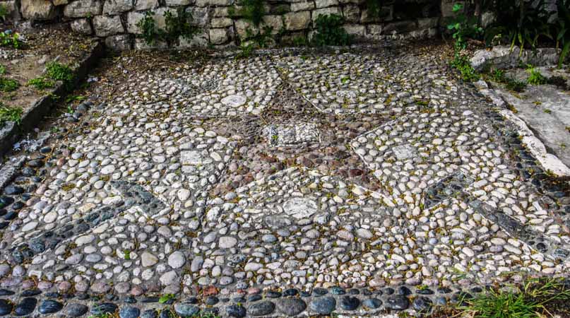 A communist mosaic in the cobbled streets of Berat Old City, Albania