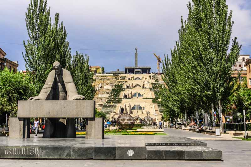 Monument to Alexander Tamanyan looking at a map of his Yerevan. Yerevan Cascade, Armenia. Soviet architecture