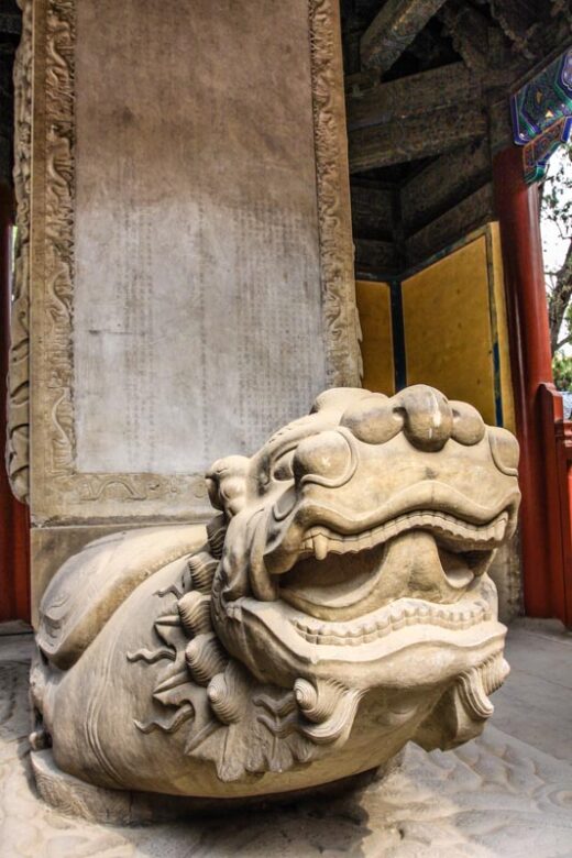 Stone Bìxì holding a slab. Chinese mythological creature, dragon with turtle shell. Temple of Confucius, Beijing, China