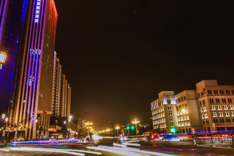 Night picture with long exposure in busy avenue with skyscraper in central Datong, China