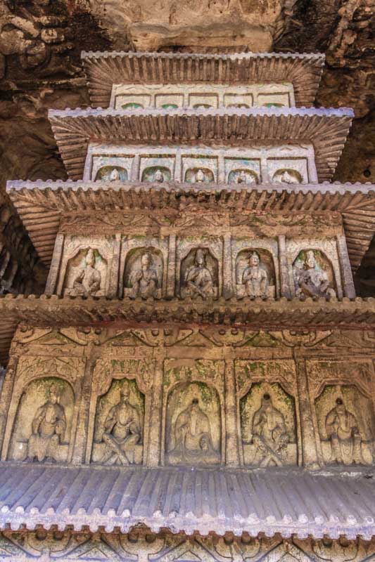 Yungang Grottoes, Datong, China: Stupa carved on the rock from floor to ceiling with niches and boddhisatvas