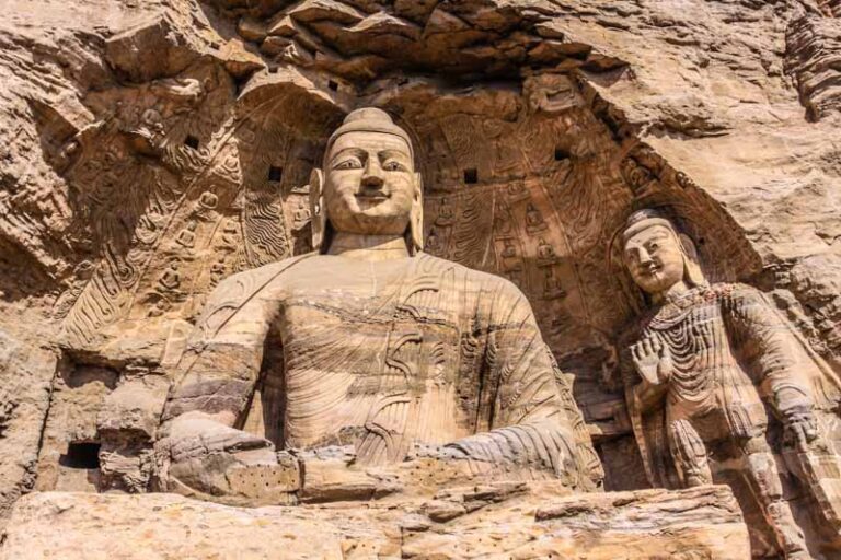 Huge Buddha carved statue in Yungang Grottoes monastery in China (Yungang Cave no. 20)