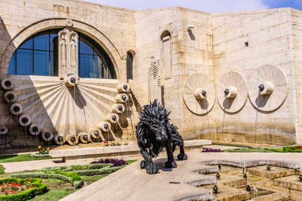 Rubber statue of a lion and vertical fountain in Yerevan Cascade, Armenia. Soviet architecture