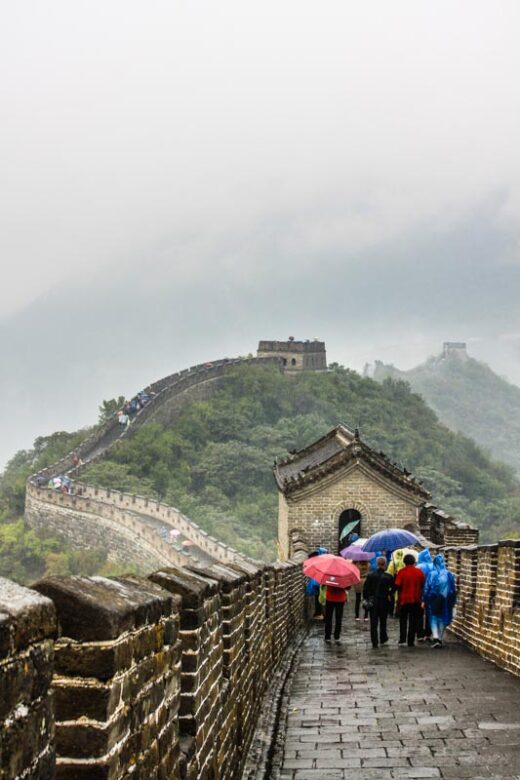 Walking on the Great Wall of China in Mutianyu, near Beijing, under a rainy weather