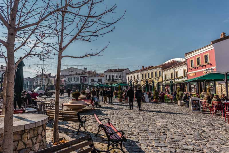 Pedestrian cobbled square in city centre. Old Market, Korçë, Albania.