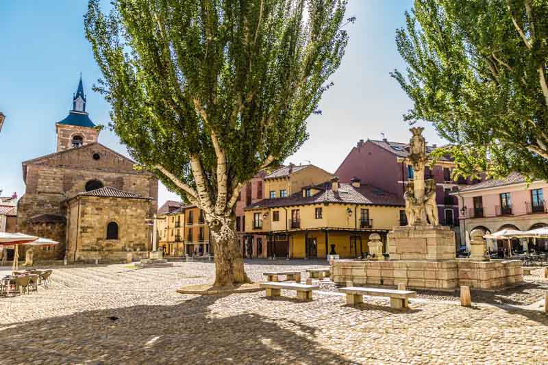 León, Spain, Plaza del Grano. Medieval market square with porticoed streets and church